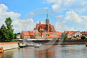 Monuments in WrocÃâaw on the banks of the Oder as seen from the other side on a sunny day